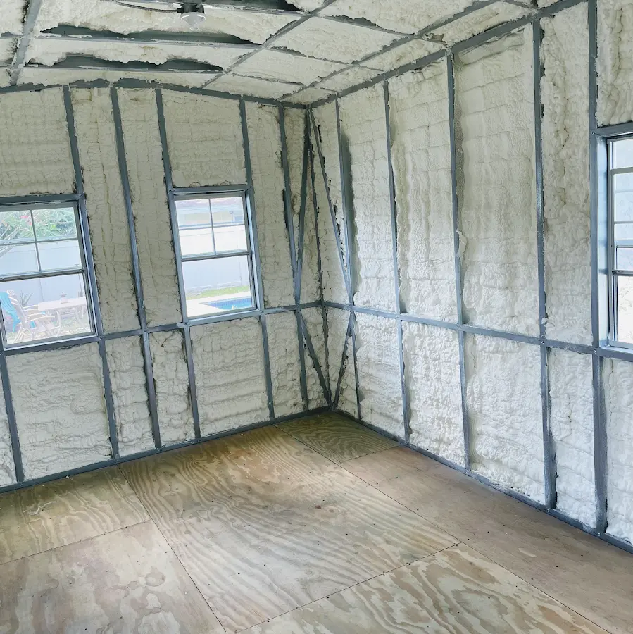 Closed-cell spray foam insulation applied to wall cavities in a residential project in Stow